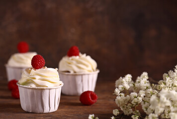 holiday cupcakes with cream and berries