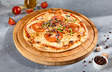 Gourmet Margherita pizza with succulent cherry tomatoes and microgreens on a wood board, a classic Italian dish presented with a modern twist