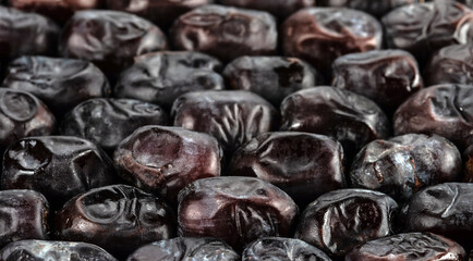 The surface texture of dried dates. Panoramic background with natural oriental sweets. Selective...