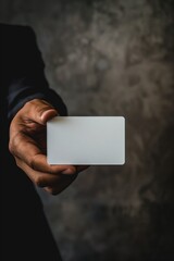 Naklejka premium Elegant Hand Showing Plain Card with Dark Backdrop