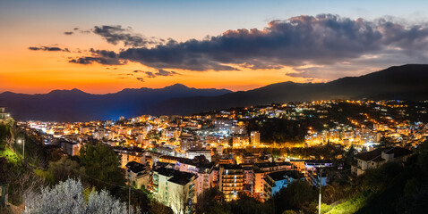 Aerial view of Sanremo town and hills at sunset, Liguria - Italy