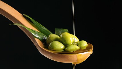 Olives and olive oil floating on a black background - 1