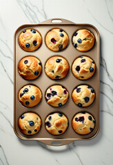 Blueberry muffin in bake tray on white floor
