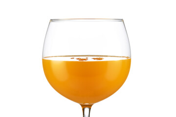 Extreme close up of orange juice in a balloon glass isolated on white background.