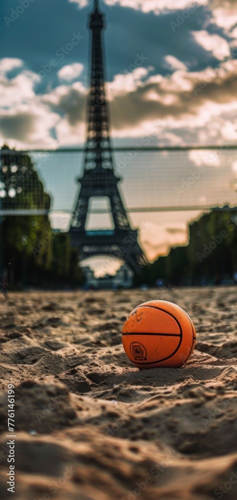 Wall mural sand volleyball court with a ball in the sand with the eiffel tower in the background concept of the