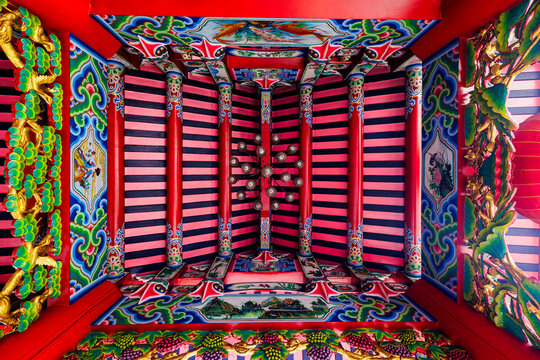 Colorful ceiling wooden structure of Chinese temple.