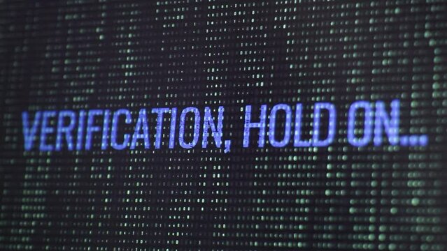 Verification, hold on message on the screen with falling code. High technology concept. Matrix-style visual effect.