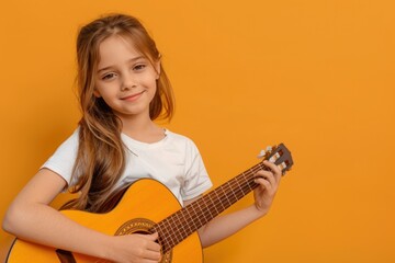 child playing guitar orange background - obrazy, fototapety, plakaty