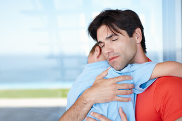 Father, son and hug in embrace for support, development and growth with eyes closed at home. Male...