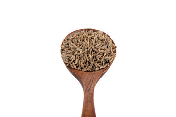 Close-up of wooden spoon full of zira or cumin isolated on white background.