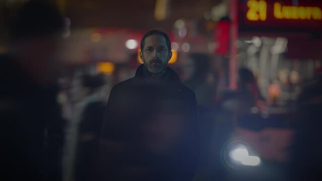 Male Person with Glasses Standing Out of the Crowd Thoughtfully Uncertain