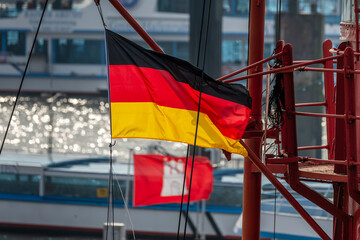 Hamburg, Germany. Flags of Germany and Hamburg in the harbor.