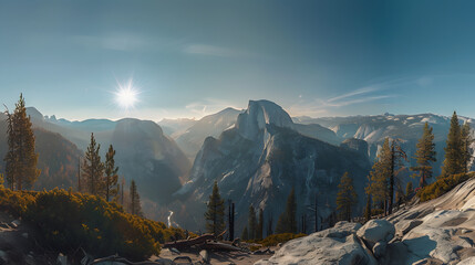 A panoramic view of a mountain range with a sun shining on the peaks - Powered by Adobe