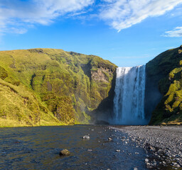 Picturesque full of water big waterfall Skogafoss autumn view, southwest Iceland.