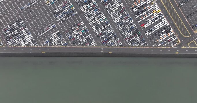 Aerial top down view on a RoRo terminal, which is short for roll on roll off terminal. Transport of rolling vehicles overseas in the port of Zeebrugge.