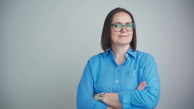 Portrait of proud business manager with her arms crossed in an assertive power stance. Smiling and confident mature business woman and creative leader with her arms folded isolated