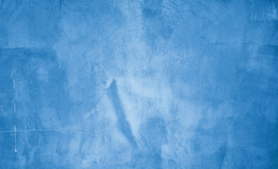 bright blue plaster concrete wall texture use as background. premium cyan wallpaper with...
