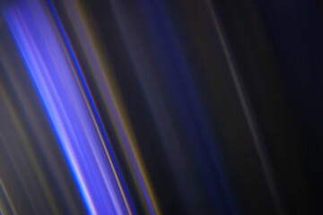 Defocused neon glow. Overlaying linear highlights. Futuristic LED lighting. Color blur on dark background