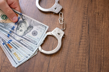 handcuffs and dollars	