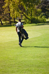 Fototapeta premium Sports, bag and walking on golf course with man or athlete outdoor on luxury holiday or vacation. Grass, field and exercise in summer on lawn with person in countryside for training or workout