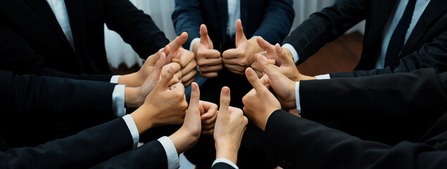Office worker team stacking hand together symbolize successful group of business partnership and...