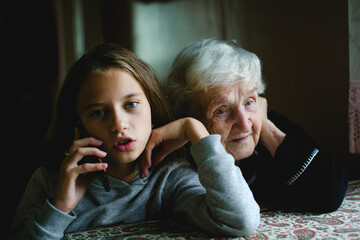 Grandma overhears her granddaughter talking on the phone. - 776202525