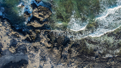 view from drone of rocks entering the sea on the island of El Hierro, Canary Islands