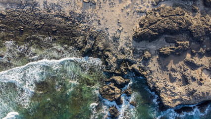 view from drone of rocks entering the sea on the island of El Hierro, Canary Islands
