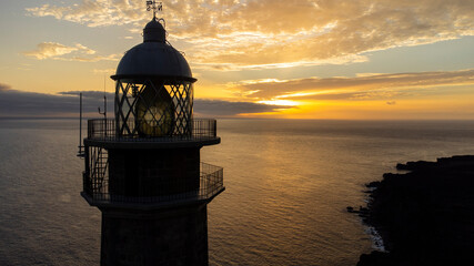 Orchilla lighthouse lens on El Hierro island at sunset