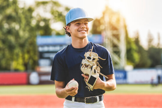 Young teen boy play baseball on a playground