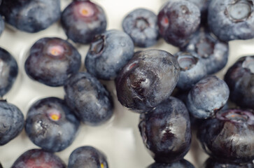 A bunch of blueberries are shown in a close up - 776210901