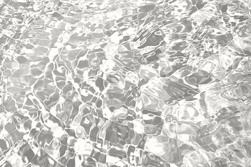 White wavy water with ripples on the surface with sunlight reflection