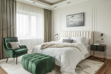 White bedroom with kale green armchair, pouf and double bed.