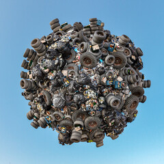 3D rendering of little planet completely covered by old tires and domestic trash over blue sky