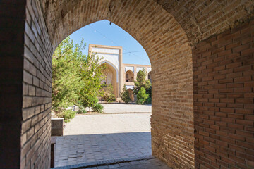 Arched entranceway to a courtyard at the Kukaldosh Madrasa in Bukhara.