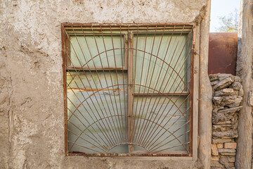 Barred window on an old building in Bukhara. - 776229767