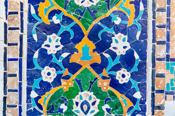 Decorative tile work on a building in the Registan in Samarkand. - 776240133