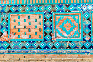 Decorative tile work at the Ustad Ali Nasafi Mausoleum at the Shah-i-Zinda in Samarkand. - 776241593