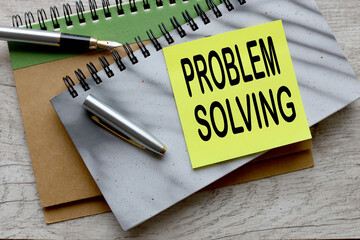 problem solving text on a sticker on a gray notepad - obrazy, fototapety, plakaty