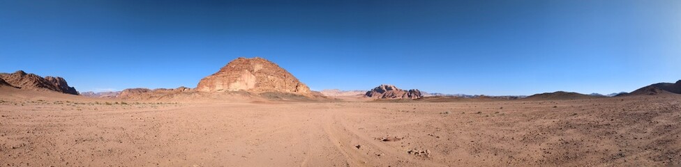 Fototapeta na wymiar Wadi Rum desert panorama landscape view with sand dunes and rocky formations,Mountains terrain Jordan