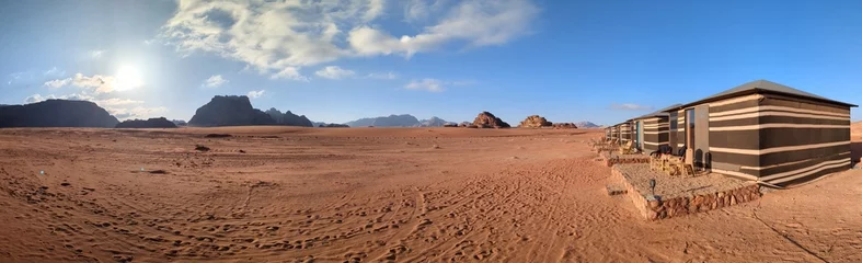 Rolgordijnen Panorama view of Wadi Rum desert with bedouin tents on flat sand landscape with mountains and rocks formations.Discover beauty of the earth. National park outdoors landscape.UNESCO World heritage site © Semi