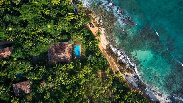 Aerial view of a villa with a swimming pool in the tropics. Hiriketiya beach, Sri Lanka. High quality photo