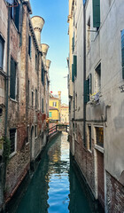 View of water canal and antic building's facades in Venice, Italy. Old historic architecture
