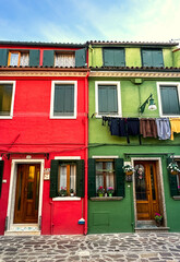 Red and green colorful facade in famous island near Venice, Burano, Italy