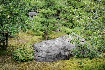 Big stone for decoration in a public Japanese park.
Great gardening concept using huge rock among...