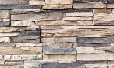 The wall is made of natural bricks in a natural color, the masonry is made of limestone. Texture...