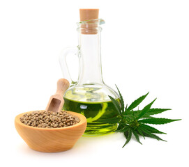 Hemp oil in glass bottle and fresh green hemp leaves. - 776297156