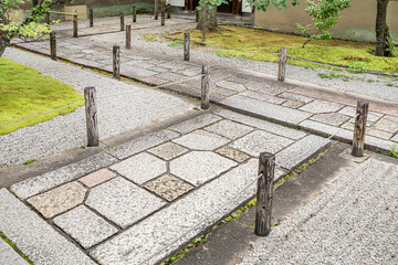 Path in a Japanese Garden.
Stone pathway with railings and trees.
