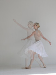 Beautiful Young Ballerina in motion. Double exposure image. Dance art, Freedom of Movement concept.