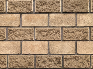 Textura de pared de ladrillos rústicos en tono beige y café